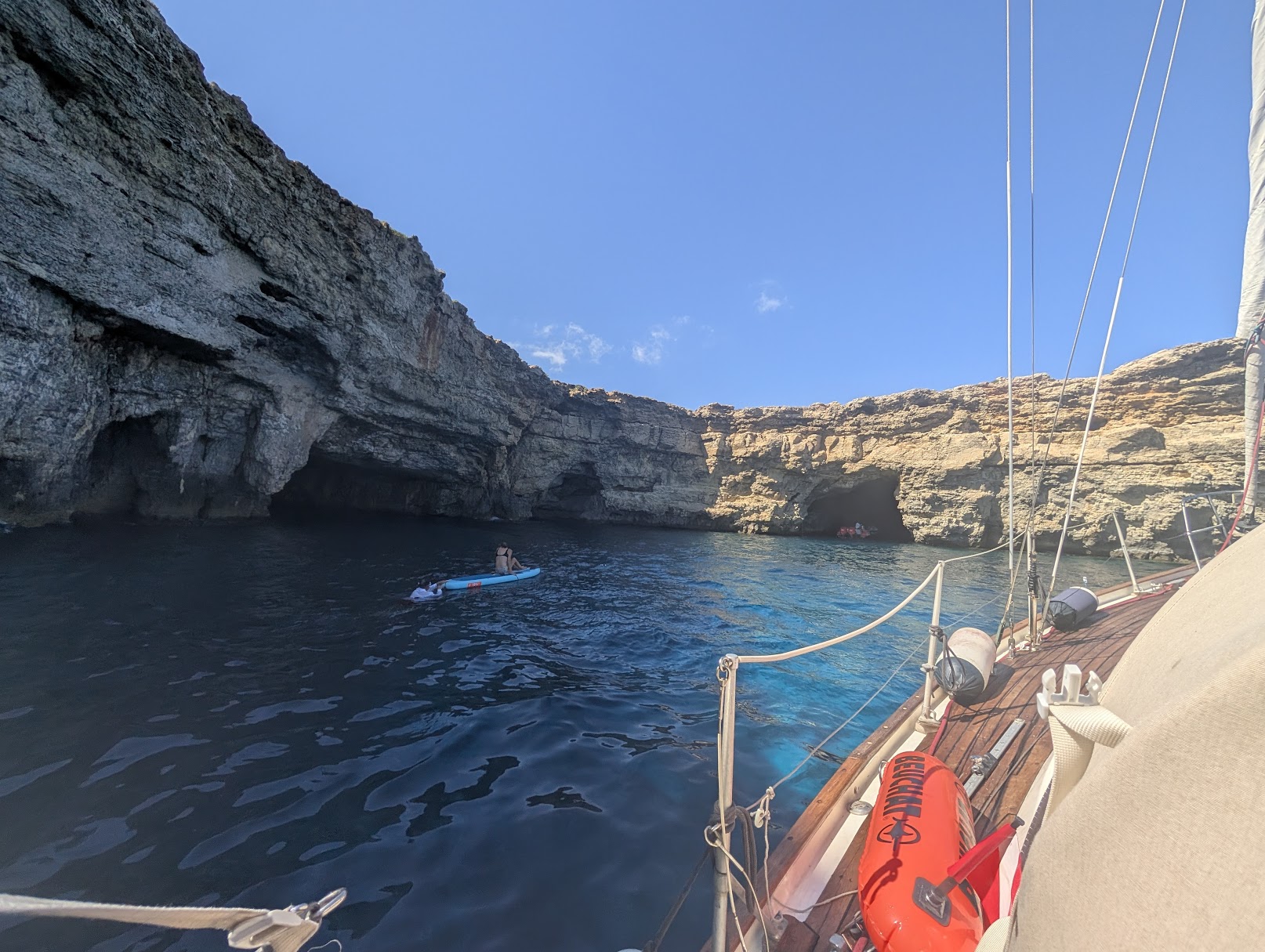 Paddle boarding between limestone caves at Comino.