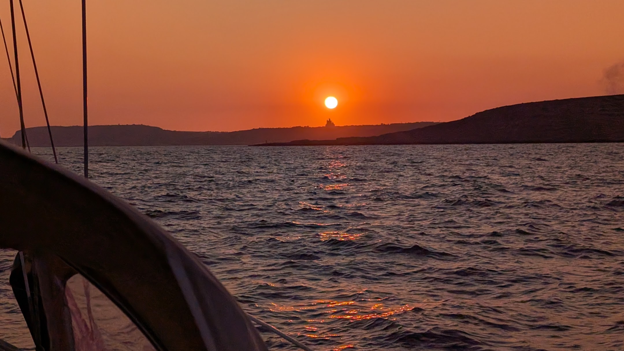 Sunset on the water from the cockpit.